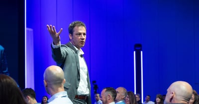 Ryan Estis speaking to a crowd.