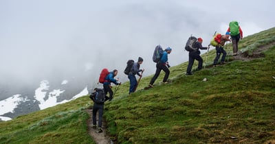 Group climbing a hill together
