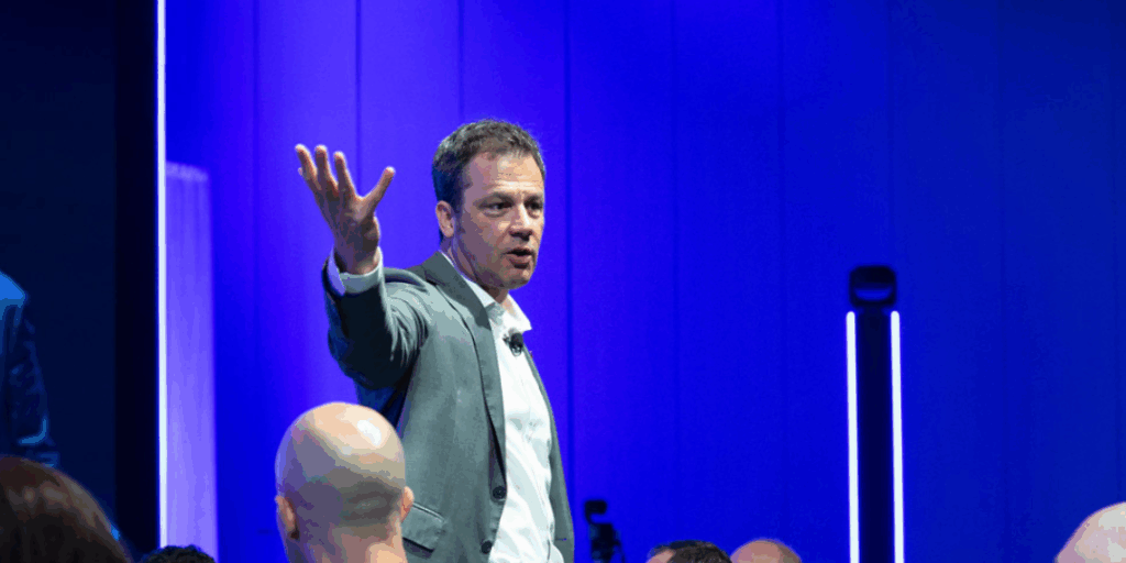 Ryan Estis speaking to a crowd.